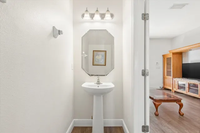a view of living room with chair and fireplace