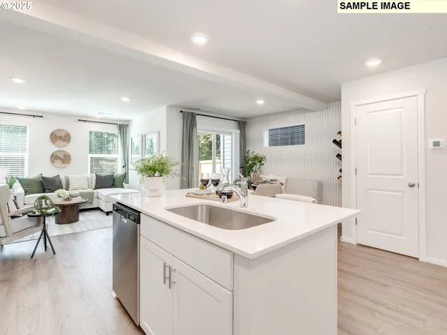 a view of living room filled with furniture and wooden floor