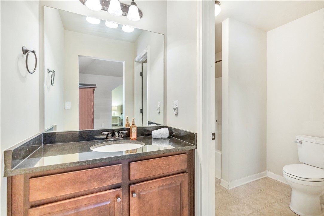 144 Buckland Drive Anderson, SC 29621 - Photo 20 of 48 This bathroom features a contemporary vanity with a granite counter and sleek sink.