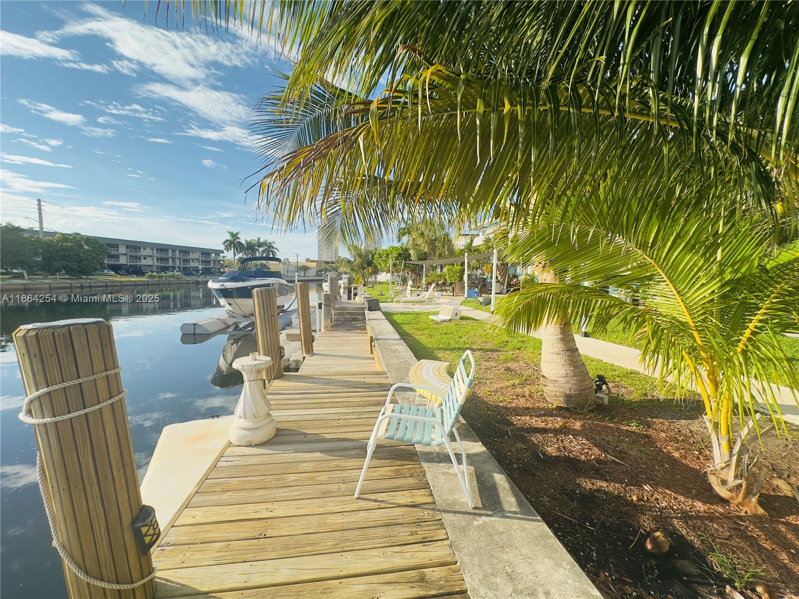 455 Golden Isles Drive, Unit 210 Hallandale Beach, FL 33009 - Photo 22 of 27 a view of outdoor space with seating area
