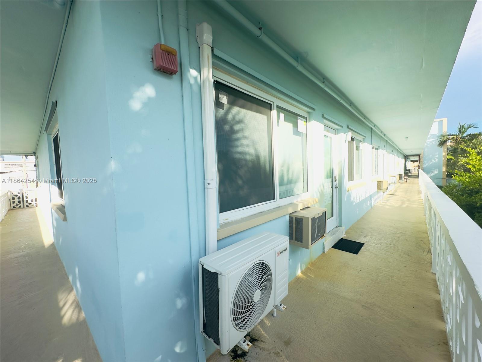 455 Golden Isles Drive, Unit 210 Hallandale Beach, FL 33009 - Photo 3 of 27 a view of a porch