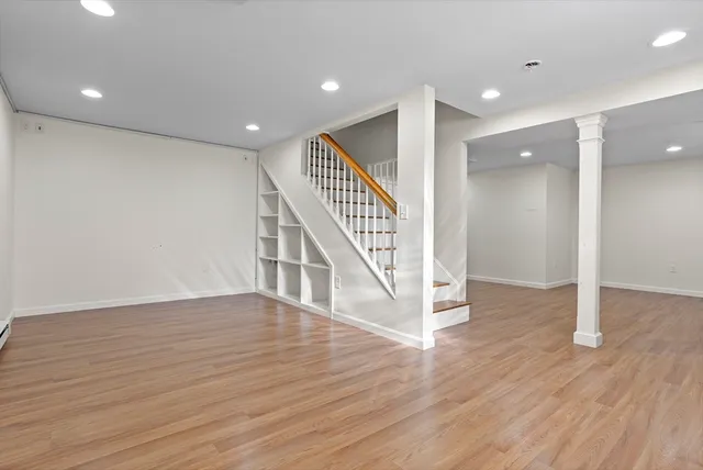 a view of an entryway with wooden floor