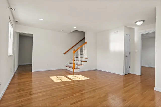a view of an entryway with wooden floor