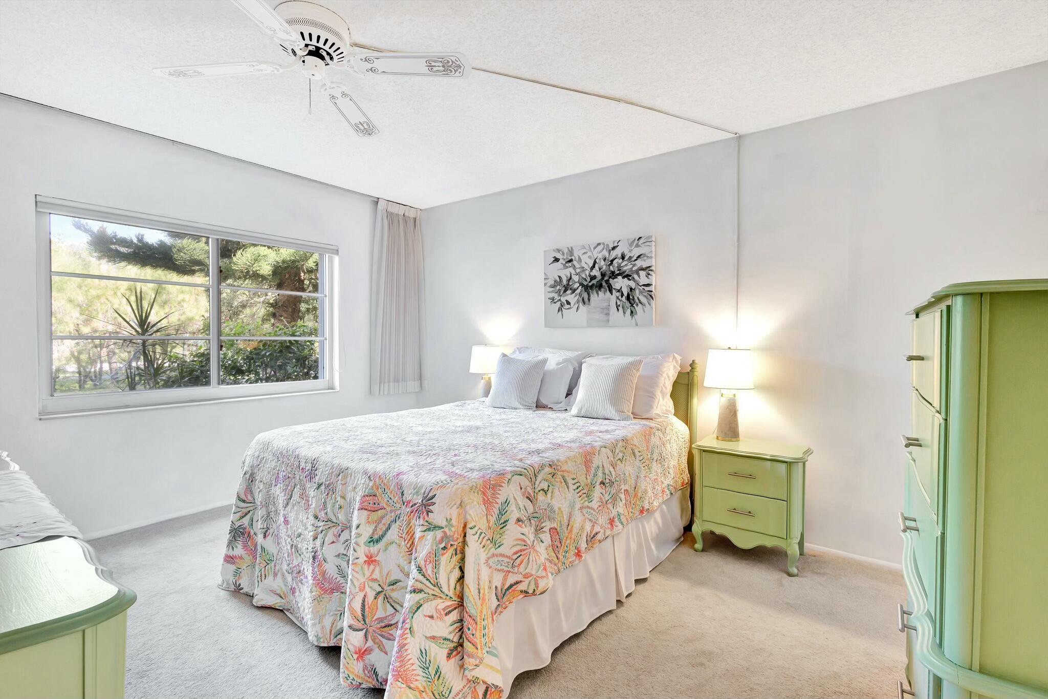 2320 Southwest 22nd Avenue, Unit 211 Delray Beach, FL 33445 - Photo 18 of 38 a bedroom with a bed and a window