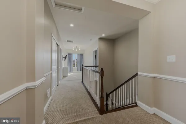 a bathroom with a sink a toilet a mirror a bathtub and shower