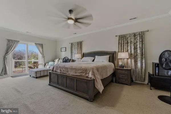 a bedroom with furniture and a window