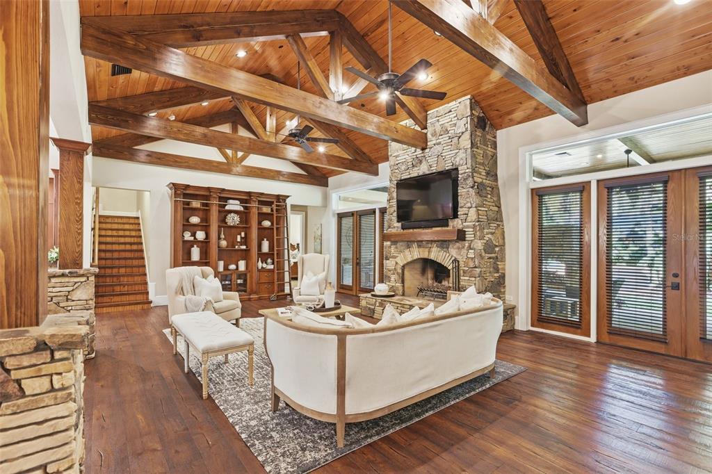 713 Main Street Windermere, FL 34786 - Photo 12 of 82 a living room with fireplace furniture and a flat screen tv