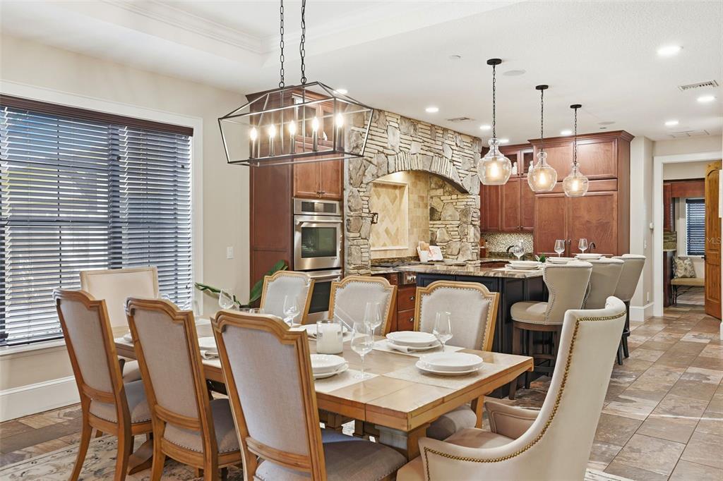 713 Main Street Windermere, FL 34786 - Photo 18 of 82 a view of a dining room with furniture large window and chandelier