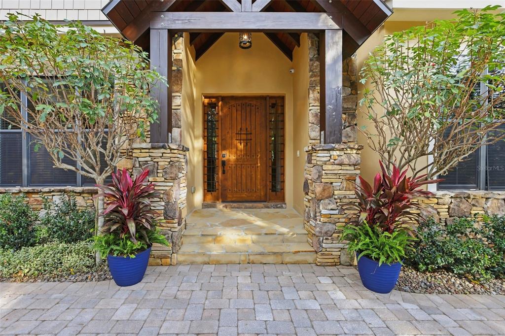 713 Main Street Windermere, FL 34786 - Photo 2 of 82 a front view of a house with a garden