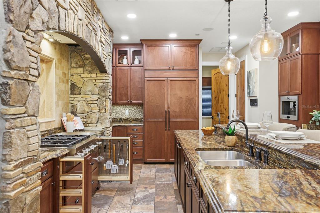 713 Main Street Windermere, FL 34786 - Photo 24 of 82 a kitchen with stainless steel appliances granite countertop a sink a stove and a refrigerator