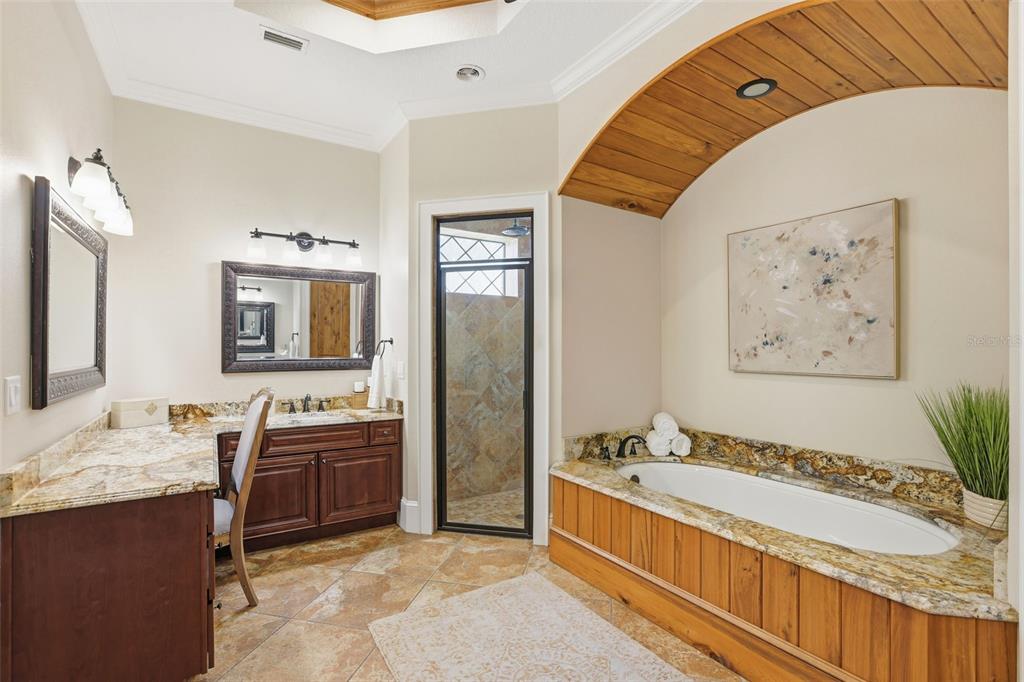 713 Main Street Windermere, FL 34786 - Photo 31 of 82 a spacious bathroom with a tub double sink and mirror