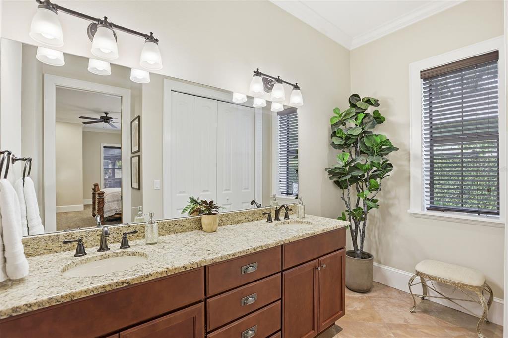 713 Main Street Windermere, FL 34786 - Photo 35 of 82 a bathroom with a granite countertop double vanity sink and a mirror