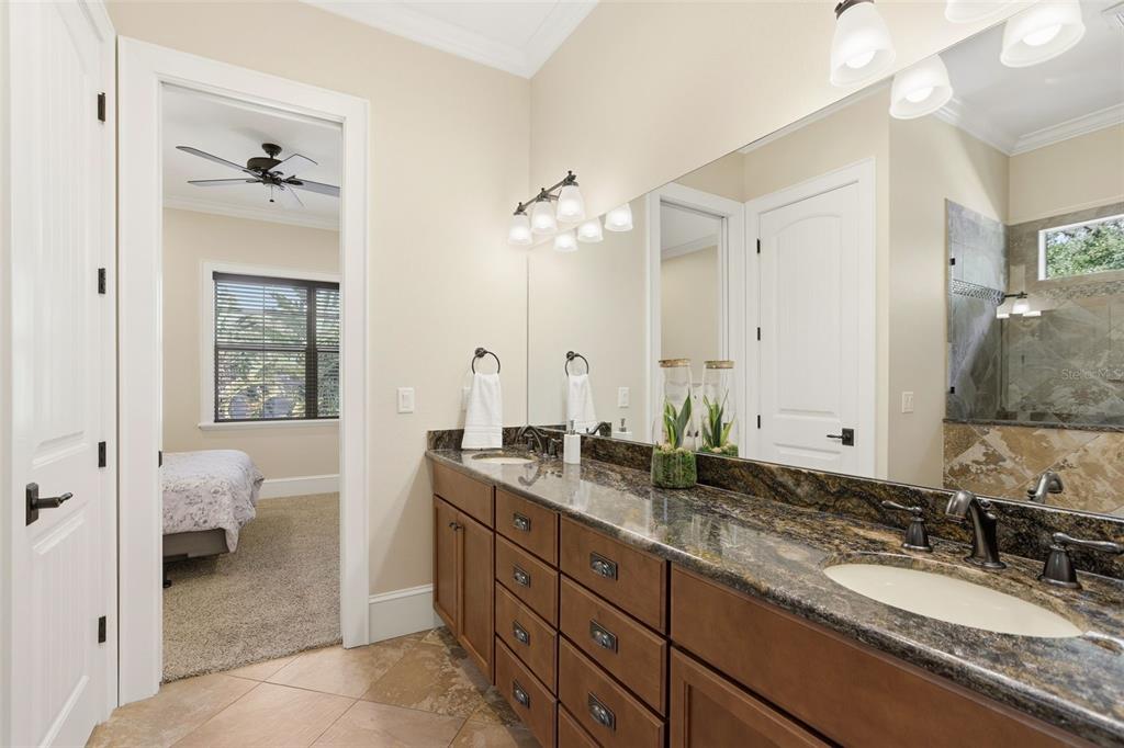 713 Main Street Windermere, FL 34786 - Photo 42 of 82 a spacious bathroom with a granite countertop sink and a mirror