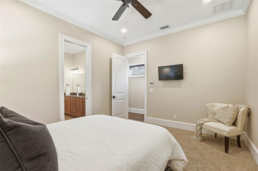 713 Main Street Windermere, FL 34786 - Photo 44 of 82 a bedroom with a bed and a chair