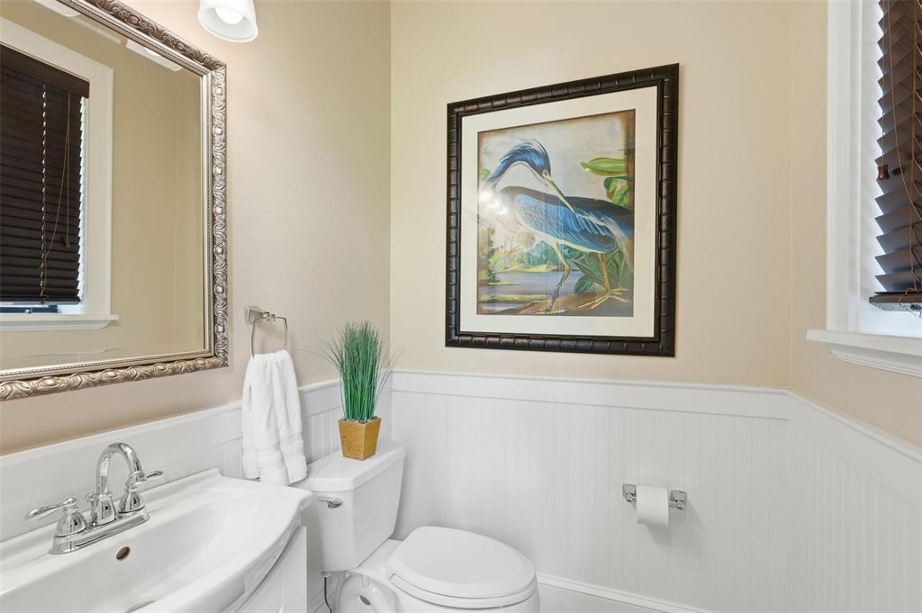 713 Main Street Windermere, FL 34786 - Photo 54 of 82 a white toilet sitting next to a bathroom sink