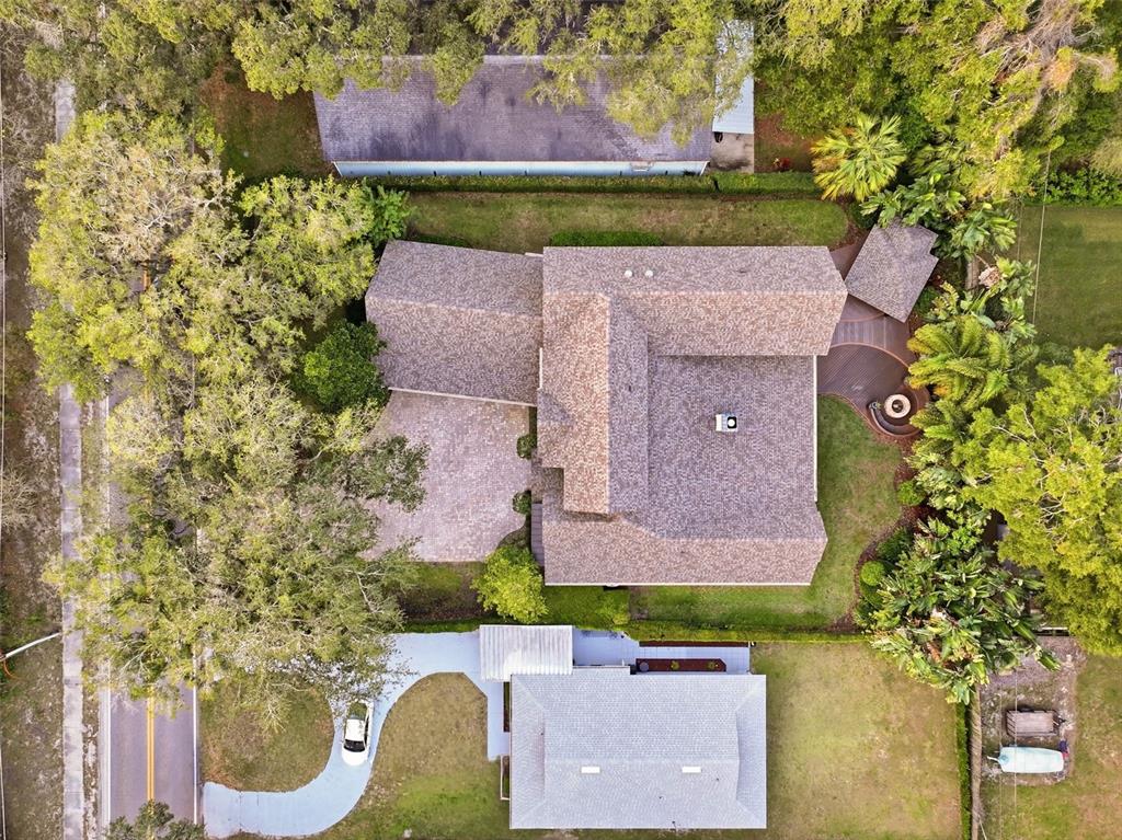 713 Main Street Windermere, FL 34786 - Photo 71 of 82 an aerial view of a house with a yard and a large tree