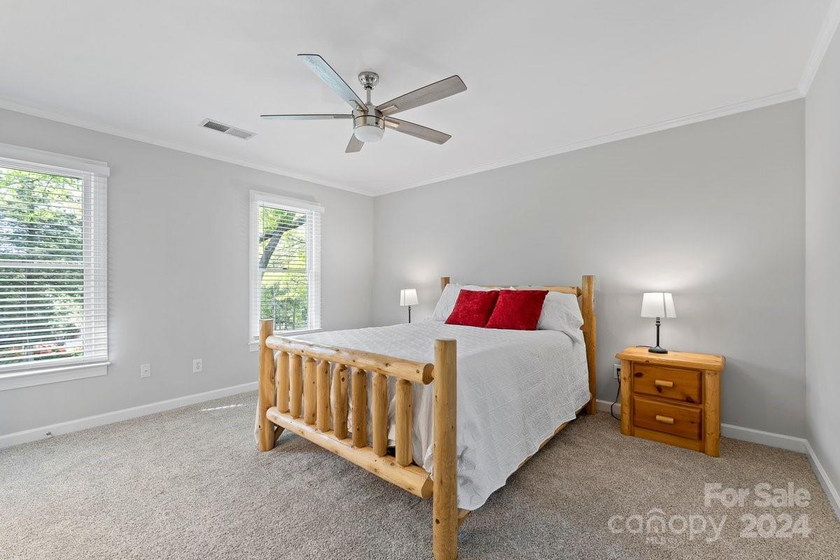 4527 Nora's Path Road Charlotte, NC 28226 - Photo 23 of 39 a bedroom with bed and a window