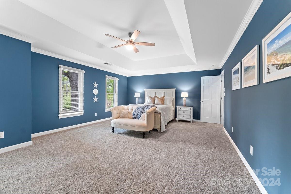 4527 Nora's Path Road Charlotte, NC 28226 - Photo 33 of 39 a bedroom with a large bed and a window