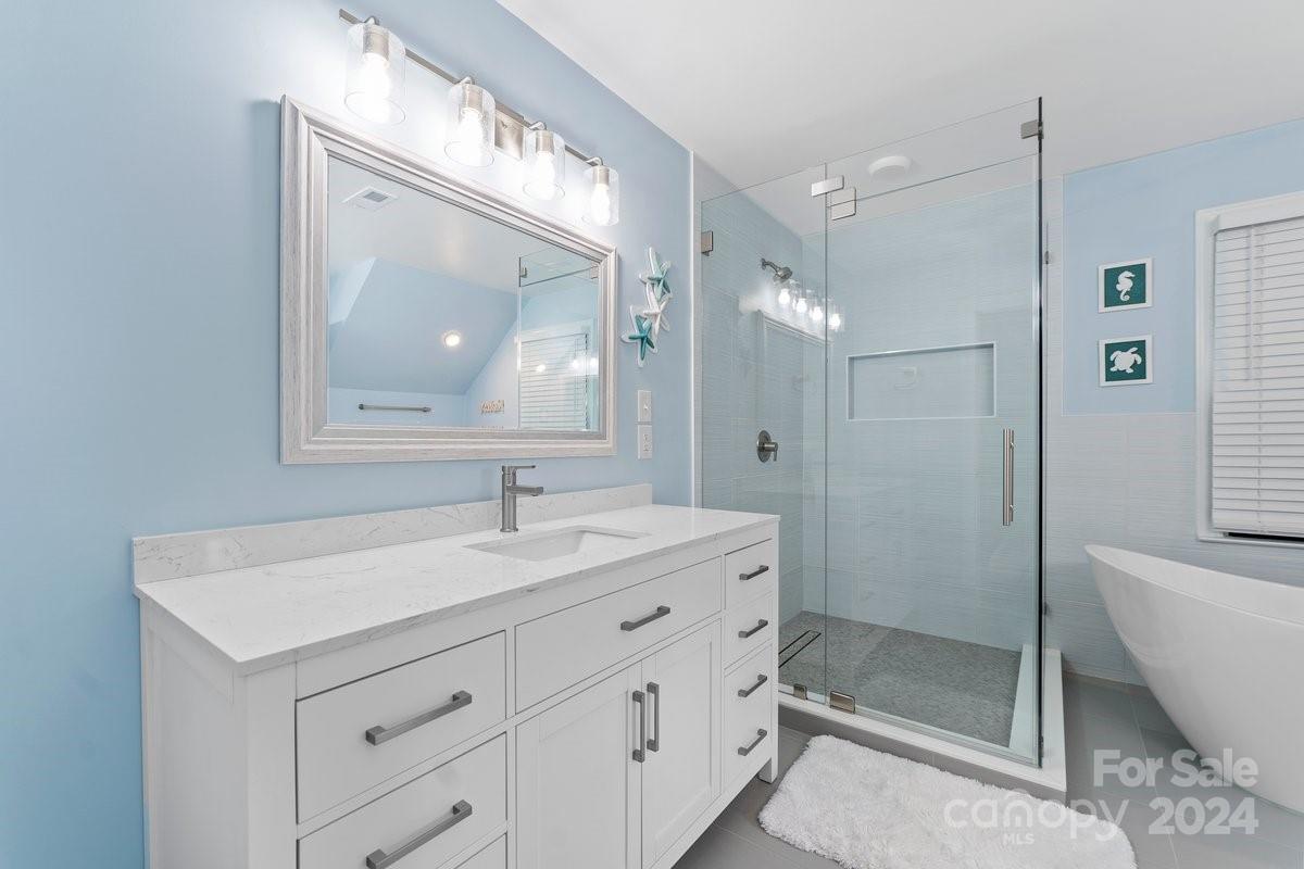 4527 Nora's Path Road Charlotte, NC 28226 - Photo 34 of 39 a bathroom with a sink a toilet a mirror and shower