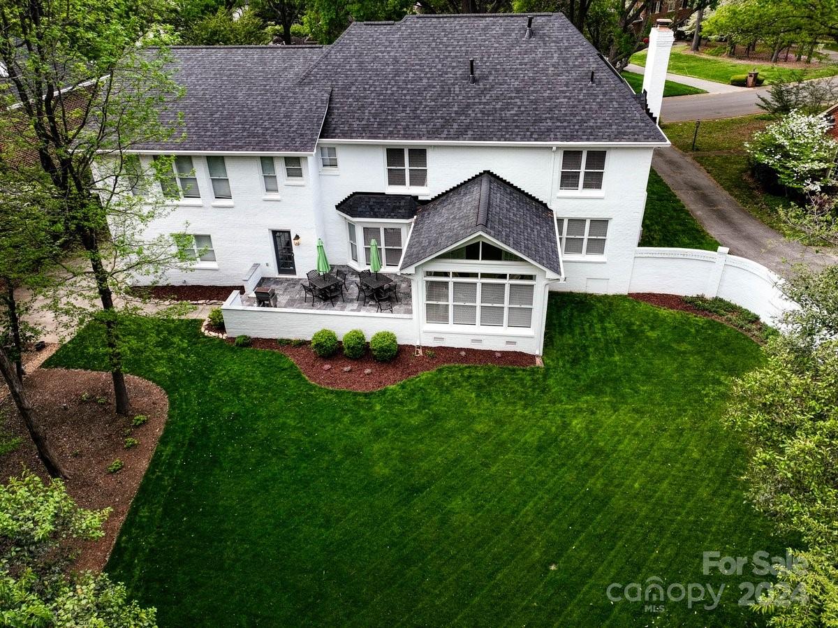4527 Nora's Path Road Charlotte, NC 28226 - Photo 5 of 39 a front view of a house with a yard table and chairs