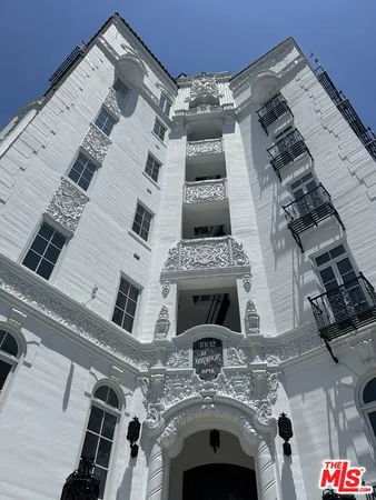 a stove top oven sitting inside of a kitchen
