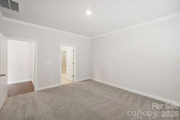 a bathroom with a double vanity sink a large mirror and a shower