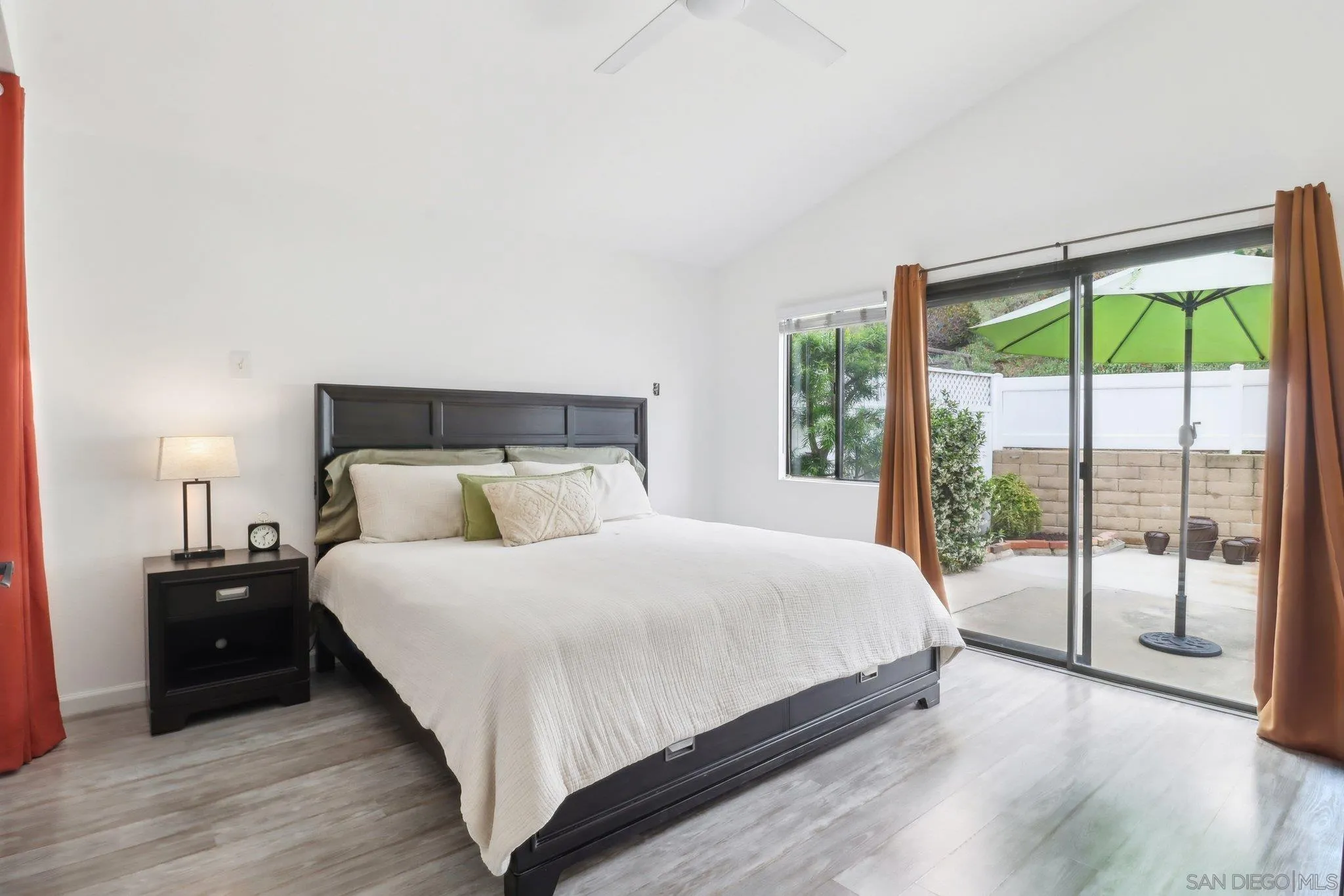 6872 Shearwaters Drive Carlsbad, CA 92011 - Photo 12 of 45 a bedroom with a bed and a large window