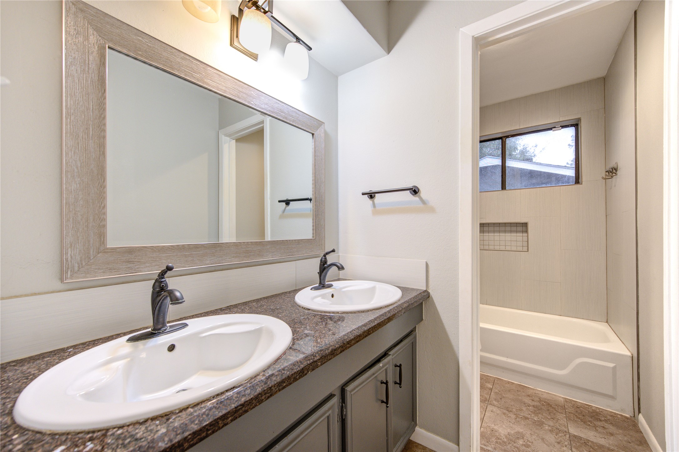 530 Enchanted Lane Spring, TX 77388 - Photo 17 of 26 a bathroom with a double vanity sink and a mirror