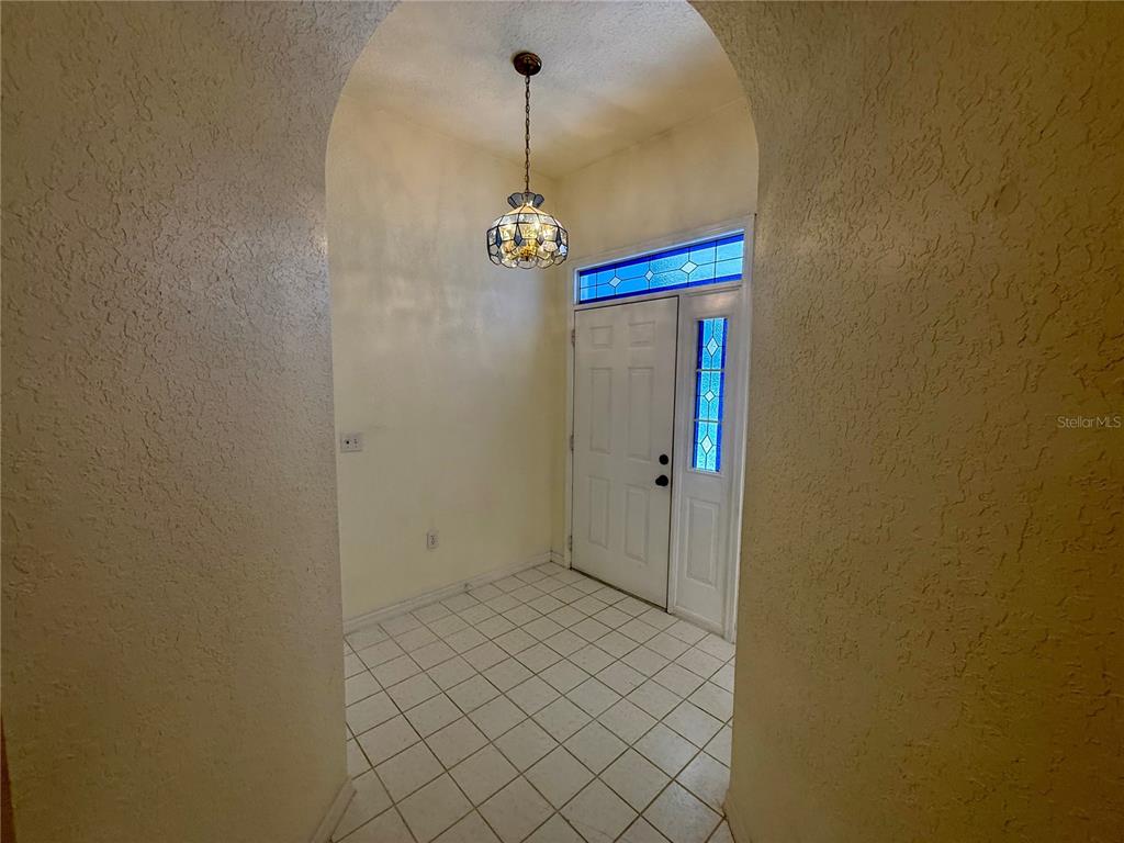 8037 Southwest 115th Loop Ocala, FL 34481 - Photo 11 of 47 a view of a room with wooden floor and windows