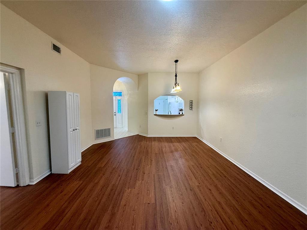8037 Southwest 115th Loop Ocala, FL 34481 - Photo 15 of 47 a view of empty room with wooden floor