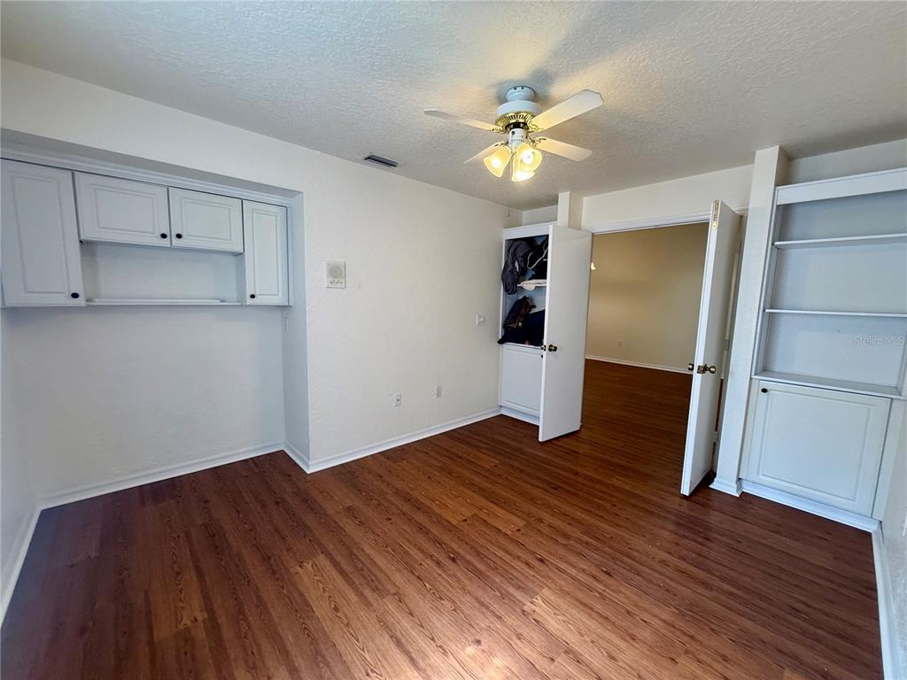 8037 Southwest 115th Loop Ocala, FL 34481 - Photo 30 of 47 a view of empty room with wooden floor