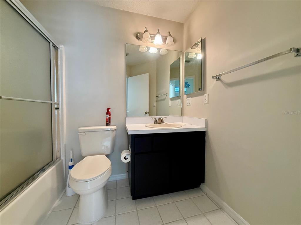 8037 Southwest 115th Loop Ocala, FL 34481 - Photo 37 of 47 a bathroom with a sink toilet and a mirror