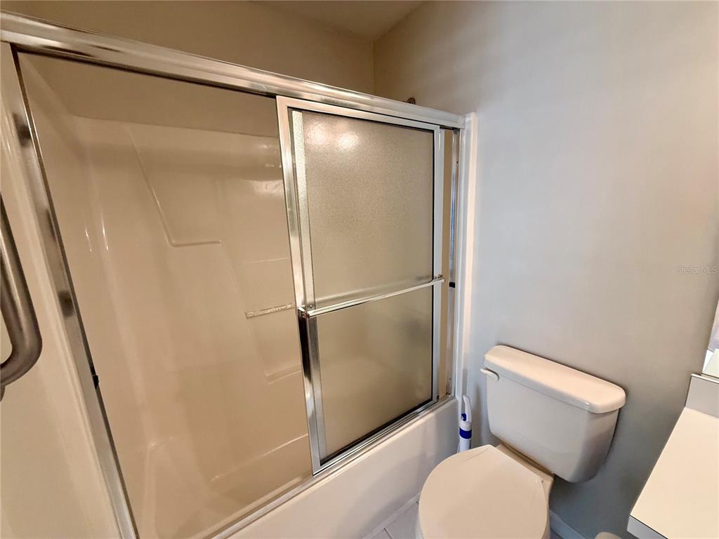 8037 Southwest 115th Loop Ocala, FL 34481 - Photo 38 of 47 a bathroom with a toilet and a shower