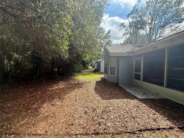 a view of a yard with an outdoor space