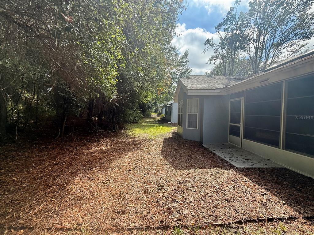 8037 Southwest 115th Loop Ocala, FL 34481 - Photo 42 of 47 a view of a yard with an outdoor space