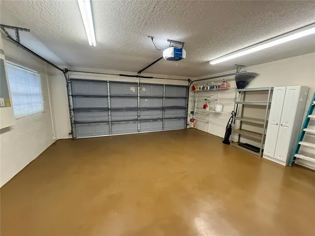 a view of an empty room with a fireplace