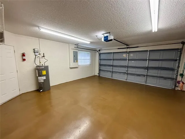 a view of an empty room with a fireplace