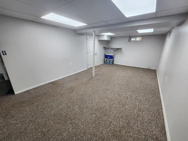 a view of a storage & utility room with a sink