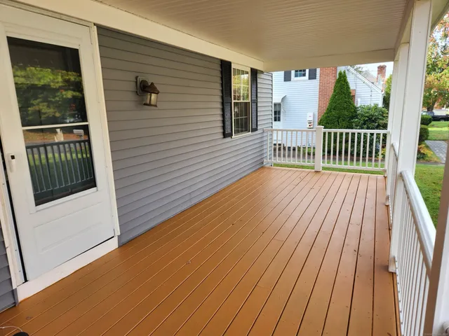 a view of a balcony with wooden floor