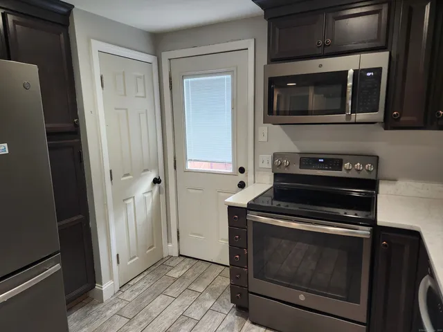 a kitchen with a stove and a microwave