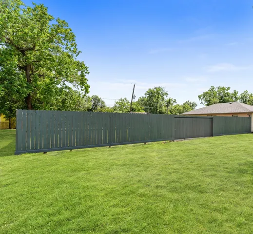 a view of backyard with green space