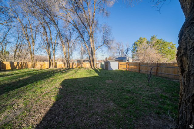 757 North 500 East Logan, UT 84321 - Photo 12 of 15 Fenced backyard with a shed