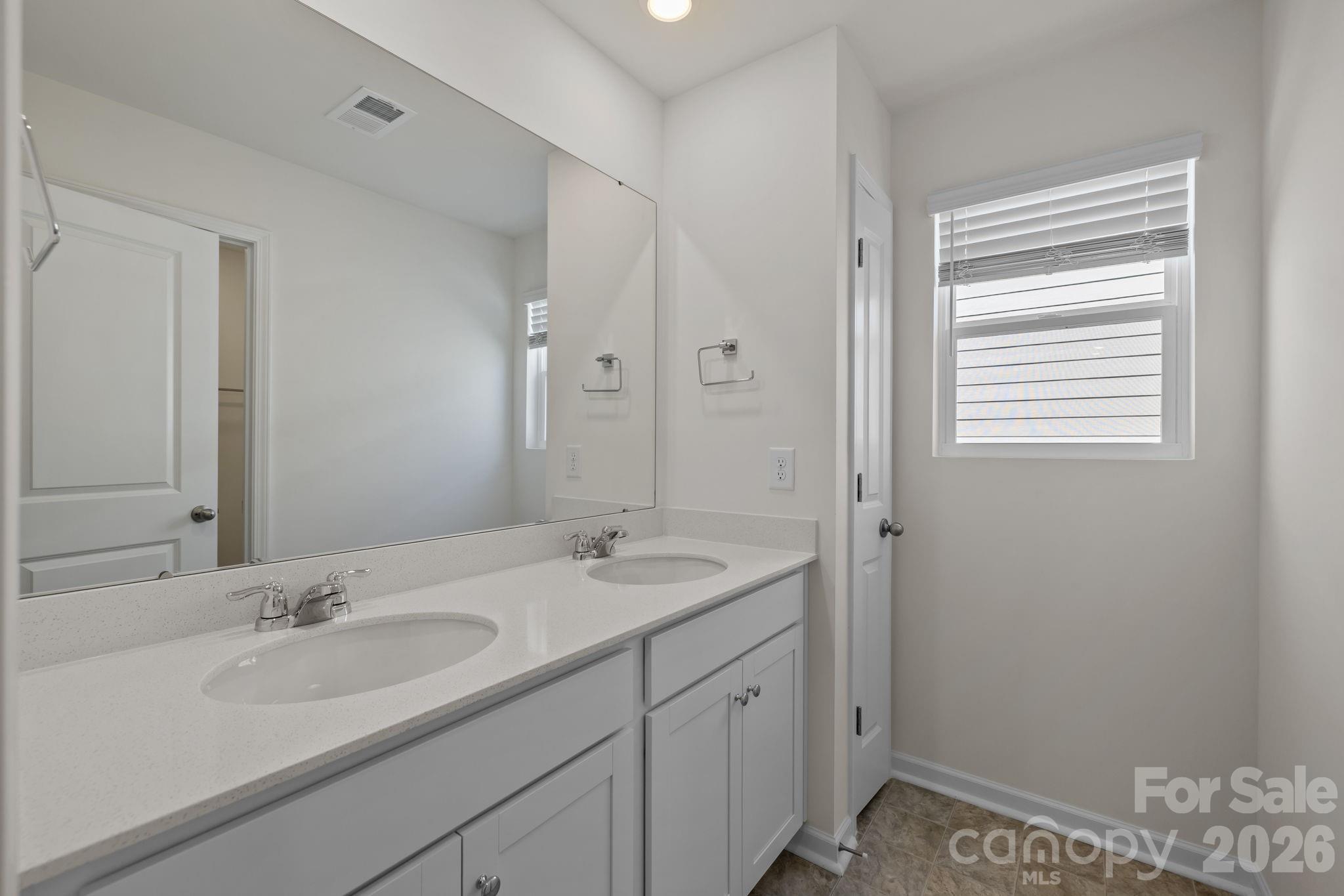463 Brick House Road York, SC 29745 - Photo 30 of 35 a bathroom with a sink double vanity and a mirror