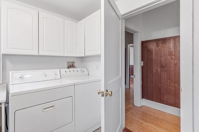 a view of storage and utility room with closet