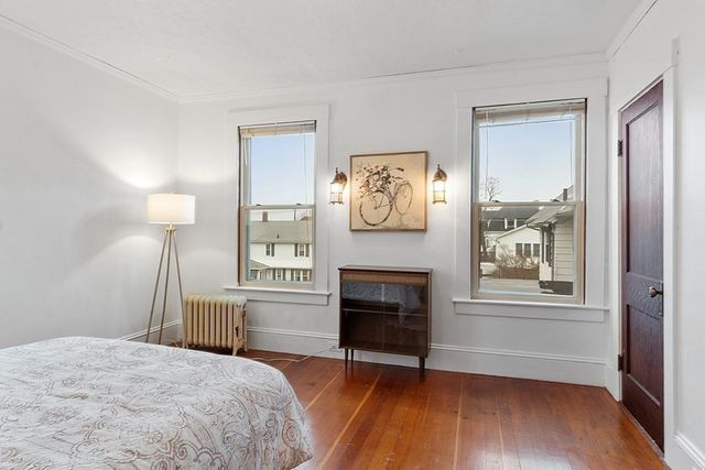a bedroom with a bed and a fireplace