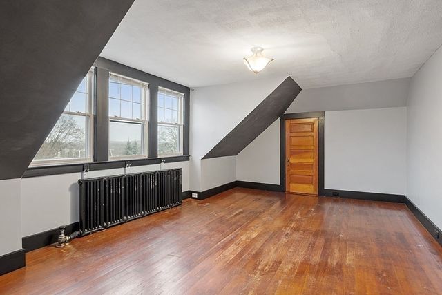 a kitchen with stainless steel appliances granite countertop a sink and a refrigerator