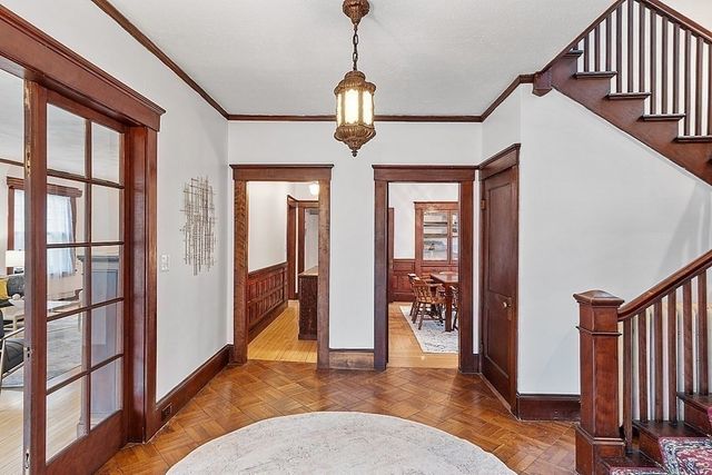 a view of an entryway with wooden floor
