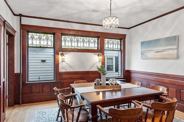 a dining room with furniture and window