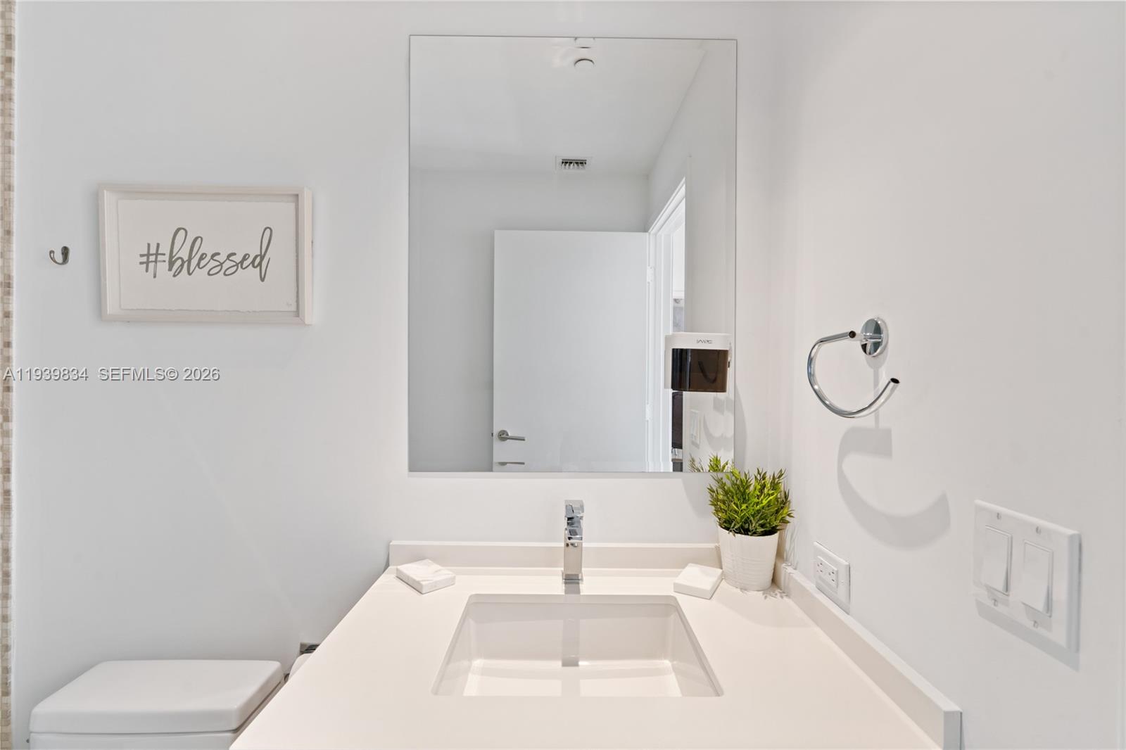 88 Southwest 7th Street, Unit 3403 Miami, FL 33130 - Photo 18 of 37 a white bath tub sitting next to a white toilet