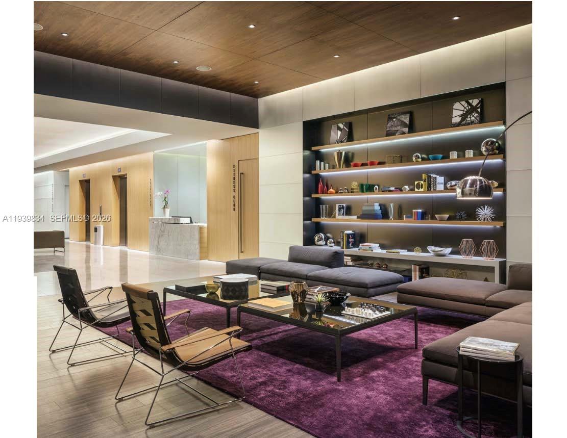 88 Southwest 7th Street, Unit 3403 Miami, FL 33130 - Photo 21 of 37 a living room with furniture a rug and a table